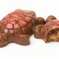 Red Turtle · Milk chocolate with signature butter caramel and toasted pecan.