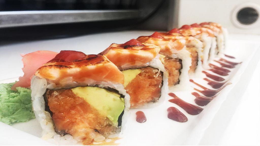 Crazy Salmon (8) · Spicy crunch salmon and avocado inside topped with grilled salmon, and with hot sauce.