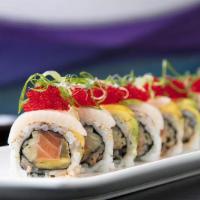 Rock N' Roll (8) · Salmon, cucumber and mango inside topped with yellowtail, and avocado with ponzu sauce.