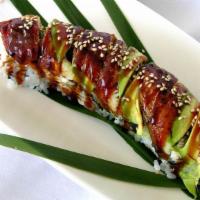 Black Dragon Roll (8) · Shrimp tempura with cucumber inside topped with eel avocado and tobiko.