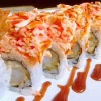 Tiger Roll (8) · Shrimp tempura and cucumber inside topped with spicy crab meat, and with eel sauce.