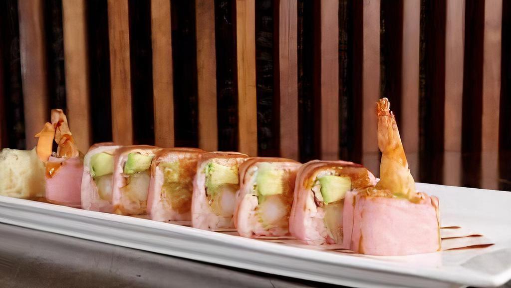 Pink Lady Roll (12) · Shrimp tempura, spicy crabmeat and avocado topped with crunch and masago, wrapped in pink soybean paper, with eel sauce, and spicy mayo sauce.
