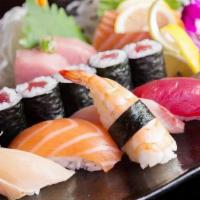 Sushi & Sashimi · Six assorted sashimi, six assorted sushi, and eight tuna roll.