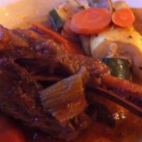 Baked Lamb Shanks Dinner · Two shanks. Served with two hot sides and a small Greek salad.