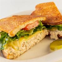 Tuna Melt Sandwich · Albacore tuna, chives, Swiss cheese, lettuce, tomato and lemon mayo on your choice of bread.