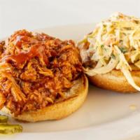 Bbq Pulled Pork Sandwich · Slow smoked pork butt smothered in homemade Texas style BBQ sauce and mildly spiced creamy J...