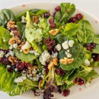 Bistro Salad · A blend of baby spinach and mixed greens topped with toasted walnuts, Gorgonzola cheese, and...