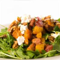 Roasted Root Vegetable Salad · Roasted seasonal root vegetables, goat cheese on mixed greens and arugula.