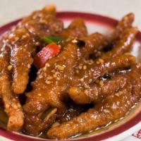 Chicken Feet · Chicken feet boiled tenderly with vinegar and sugar then steamed with black bean sauce.