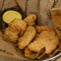 Chicken Tenders · Hand-battered and baked tenders, add Fries +1 Toss’em with your chocie of sauce +1