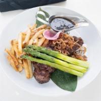 Ny Strip · A 12 oz. NY Strip topped with fried Shallots in a House Steak Sauce, served with Truffle Fries