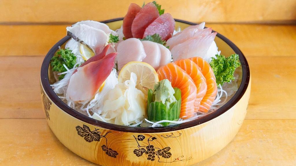 Sashimi Set · Chef's daily selection of 10 Sashimi (no rice) pieces. Served with a house salad (spring mix, tomatoes, cucumbers, avocado w/ honey mustard dressing) and Miso soup