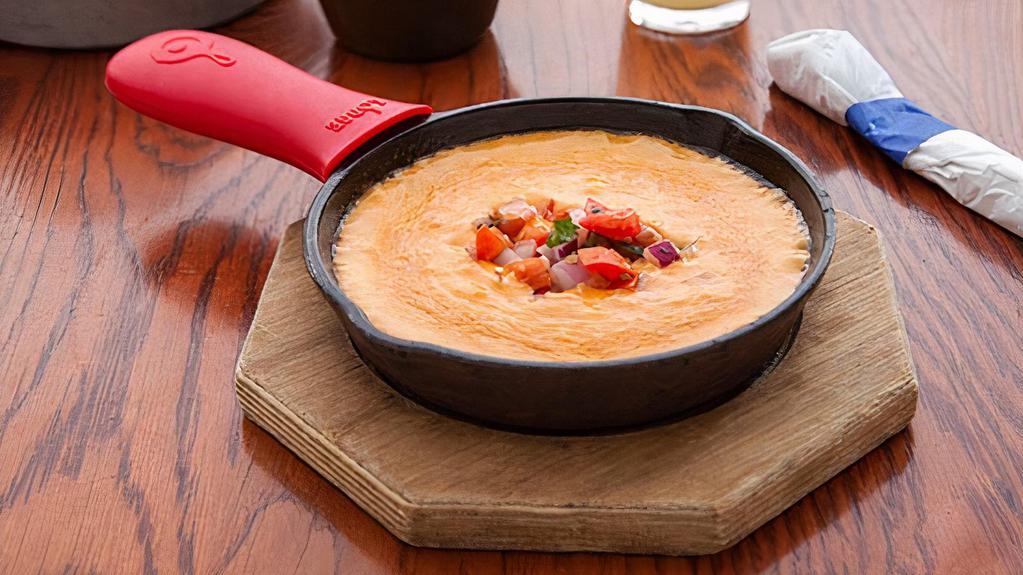 Queso · Our distinctive Mexican melted cheese dip.