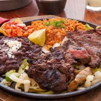 Original Grilled Fajitas · Served on a bed of seasoned onions and peppers with Mexican rice and beans, sour cream, guac...