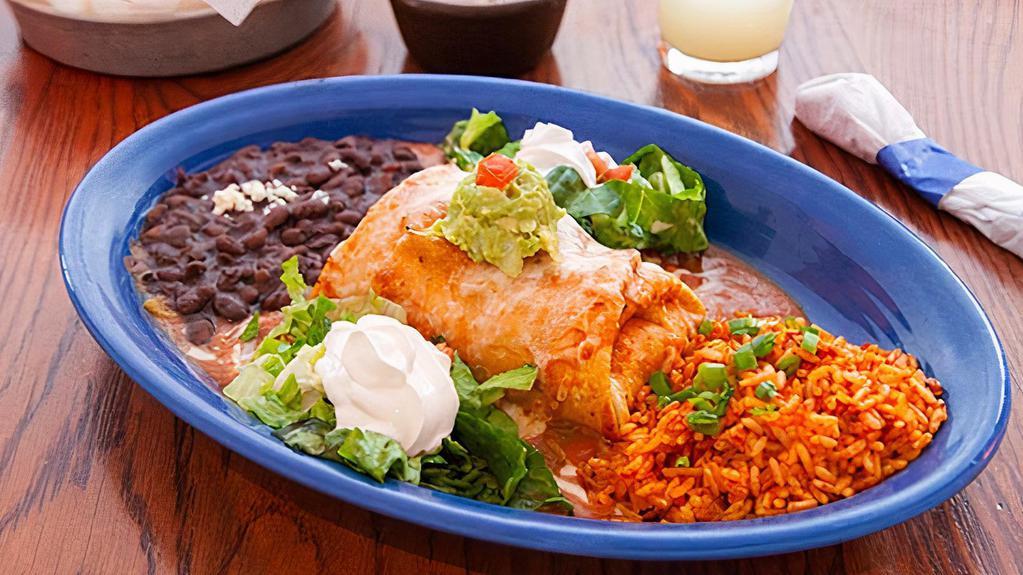 Chicken Chimichanga · Most popular. Seasoned chicken and cheese rolled into a flour tortilla, lightly fried, then baked in our mild red chile sauce. Served with guacamole, crema, Mexican rice, and beans.