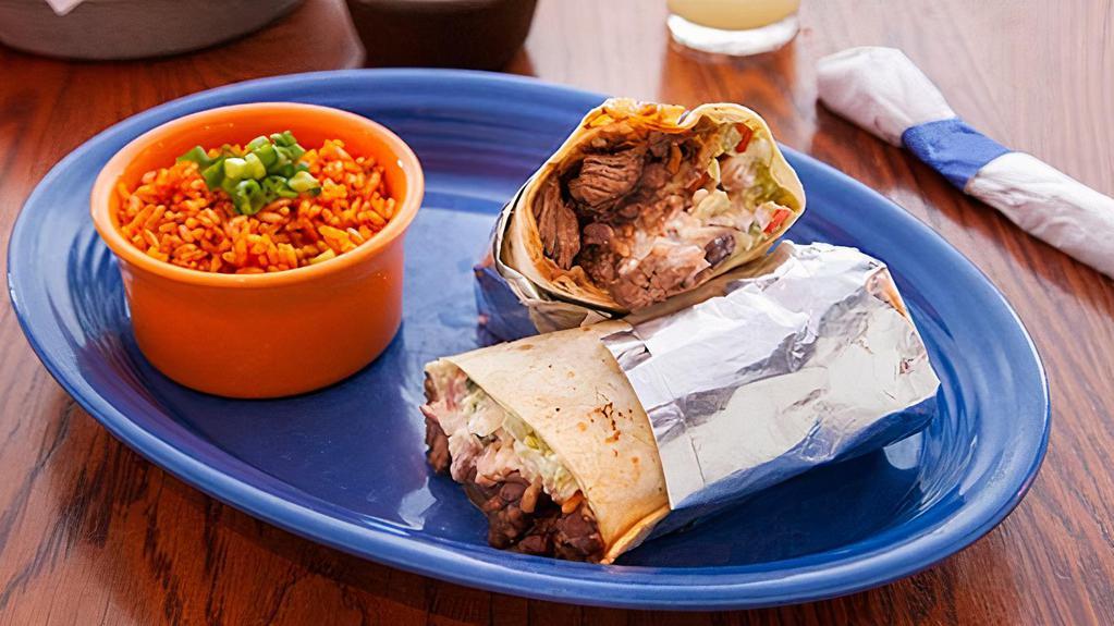 Juan'S Burrito · Most popular. Handheld burrito filled with your choice of protein, with Mexican rice, black beans, cheese, salsa fresca, crema, and guacamole. Served with Mexican rice, beans, or fries.