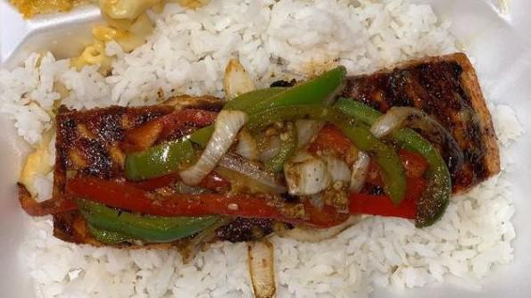 Grilled Salmon · Butter garlic salmon with sautéed onions ,red& green peppers.