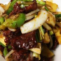 Mongolian Beef · Green pepper, beef stir fried with bamboo shoot, mushroom, onions & scallions in special spi...