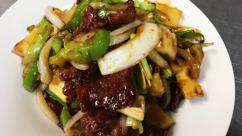 Mongolian Beef · Green pepper, beef stir fried with bamboo shoot, mushroom, onions & scallions in special spicy sauce.