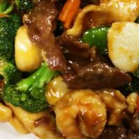 Happy Family · A variety of veggies blend with shrimp, scallop, chicken and beef stir fried in a chef speci...