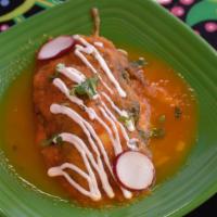 Chile Relleno · One poblano pepper egg-battered, stuffed with cheese, topped with red traditional salsa and ...