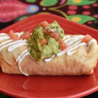 Chimichanga · Crispy fried burrito with your choice of filling, stuffed with cheese, rice and beans. Toppe...