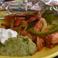 Chicken Fajitas · Marinated strips of chicken, grilled with fresh bell peppers and onions. Served with guacamo...