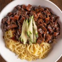Jja Jang Myeon · Stir-fried black bean sauce, onions, zucchini and pork over noodle.