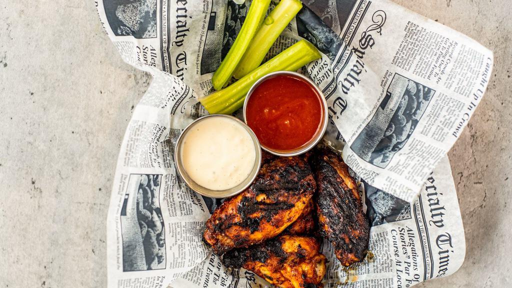 Smoked Wings · 10 of our smoked wings that are slow cooked for two hours with our house rub. They can be dry or tossed with one of our famous wing sauces.