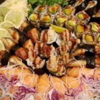 Shrimp Dragon · (In) Shrimp tempura 
(Top) Tiger shrimp & eel sauce