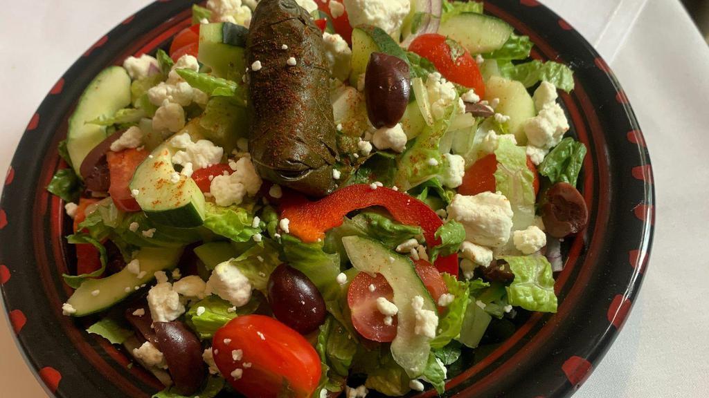 Mediterranean Salad* · Gluten Free. Vegetarian. Crispy Romaine Heart, Olives, Cucumbers, Tomatoes, Grape Leaves, Lemon-Oil Vinaigrette