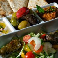 Mediterranean Sampler (Vegan) · Hummus, Roasted Veggie Dip, Mixed Olives, 3 Stuffed Grape Leaves, Cucumbers, Toasted Pita