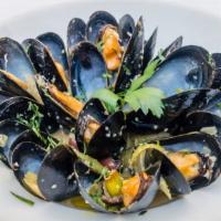 Steamed Mussels · Fresh Mussels sauteed in a homemade tomato sauce, Tarragon herbs, garlic Crostini.