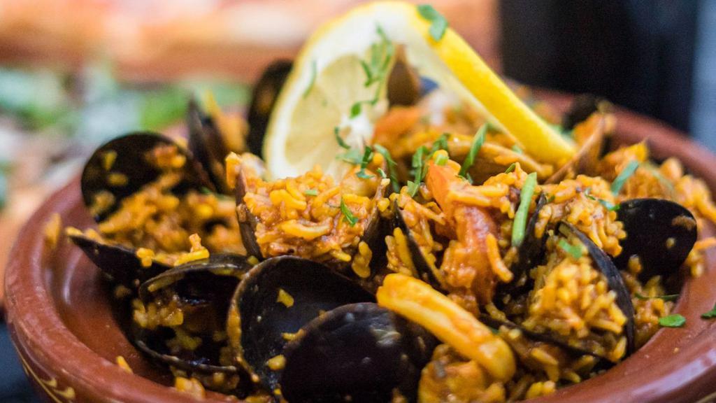 Paella* · Gluten Free. Byrsa Bistro Style Paella, Calamari, Clams, Mussels, Fish, Shrimp, Olives, Saffron Rice.