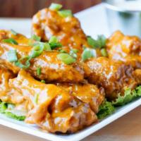 Boneless Wings · Served with choice of sauce.