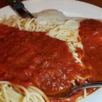 Spaghetti & Meatballs · Spaghetti, homemade meatballs, red sauce, cheese, herbs.
