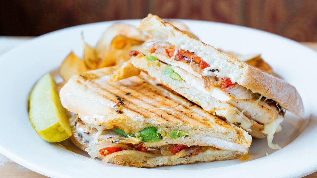 Chicken And Avocado Panini · Grilled chicken, roasted red peppers, sautéed onions and provolone.
