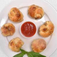 Garlic Knots (6) · It comes with marinara sauce.