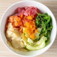 Signature Poke Bowl · Serve with salmon, ahi tuna* seaweed salad, ginger, sesame, cucumber, masago egg*, spicy may...