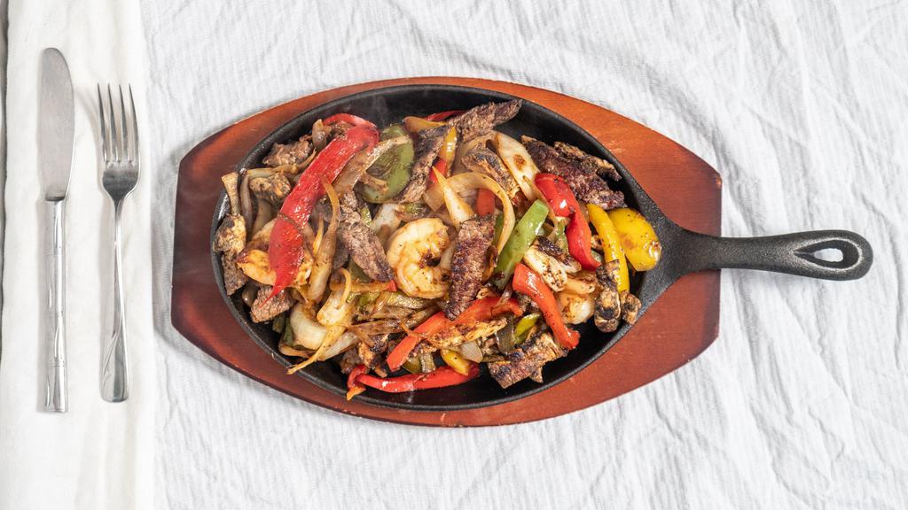 Fajitas Platter · Your choice of veggie, chicken, steak, shrimp, or Texanas (steak, shrimp and chicken). Your choice of fajitas, mixed with bell peppers and onions. Served with a side of lettuce, pico de gallo, guacamole, sour cream, and cheese. Includes Mexican rice, your choice of beans, and warm tortillas.