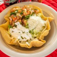 Taco Salad · A fried flour bowl filled with your choice of meat. Topped with lettuce, pico de gallo, sour...