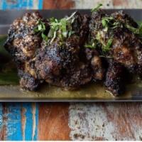 Jerk Wings · 12-hour marinated and pimento smoked