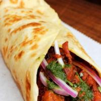 Chicken Tawa · Julienne cut chicken cooked in our Homemade Indian spices, Fresh Mint-Coriander Chutney, Red...