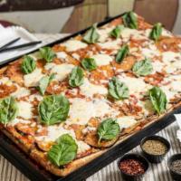 Parmigiana Pizza (Half Tray) · Vegetarian. Tomato pulp, eggplant, mozzarella, parmigiano cheese, and basil.