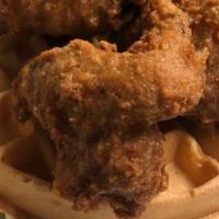 Fried Chicken & Waffle · Four piece golden fried chicken on top of our homemade belgium waffle.