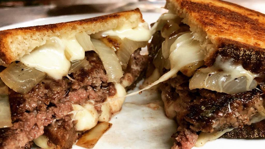 Patty Melt Grilled Deluxe · Grilled Cheese on rye bread with beef patty, sauteed onions, Swiss cheese, with french fries.
