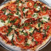 Margherita · Light marinara, fresh mozzarella, sliced tomatoes, basil