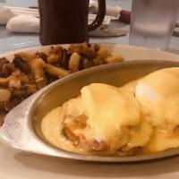 Smoked Salmon Benedict · Two dropped eggs with Atlantic smoked salmon and grilled tomato topped with hollandaise sauc...