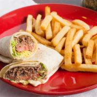 Cheesesteak Wrap · Served on a flour tortilla with french fries lettuce and tomato.