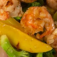 Mango Shrimp · Ten pieces grilled jumbo shrimp with fresh mango and vegetable in chef mild spicy brown sauce